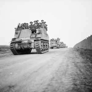 The British Army in Normandy 1944 Infantry are carried forward in Priest carriers on the eve of Operation 'Totalise', 7 August 1944.