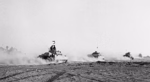 IWM caption : El Alamein 1942: British tanks move up to the battle to engage the German armour after the infantry had cleared gaps in the enemy minefield.