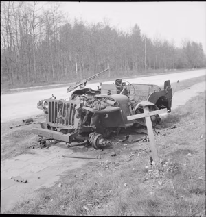 The British Army in North-west Europe 1944-45 The grave of a British soldier who was killed during Operation Market Garden in 1944, lies alongside the wreckage of his jeep near Arnhem, 18 April 1945.