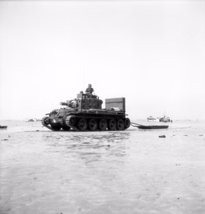 A British Centaur IV of the Royal Marine Support Group. It is towing an ammunition sled.