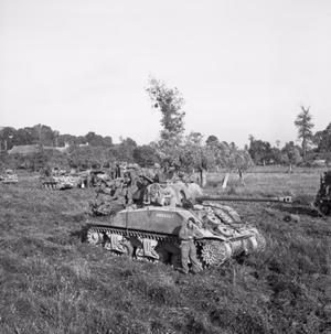 British infantry and Sherman tanks wait to advance at the start of Operation 'Goodwood', Normandy, 18 July 1944. Infantry and Sherman tanks wait to advance at the start of Operation 'Goodwood', 18 July 1944. A Sherman Firefly is in the foreground.