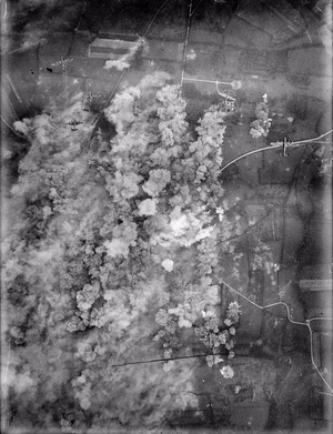 Royal Air Force Bomber Command, 1942-1945. Avro Lancasters carpet bomb a road junction near Villers Bocage, Normandy, France through which the 2nd and 9th SS Panzer Divisions were expected to move to carry out an attack on the junction of the British and American armies. The daylight attack, by 266 aircraft of Nos. 3, 4 and 8 Groups, was carried out at 4,000 feet to ensure that the target indicators dropped by the Pathfinders were seen and 1,100 tons of bombs were dropped with great accuracy.