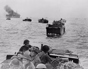 Infantrymen of The Royal Winnipeg Rifles in Landing Craft Assault (LCAs) en route to land at Courseulles-sur-Mer, France, 6 June 1944.