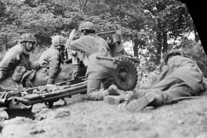 A 6-pdr anti-tank gun of No. 26 Anti-Tank Platoon, 1st Border Regiment, 1st Airborne Division at Arnhem, 20 September 1944. The gun was at this moment engaging a German PzKpfw B2 (f) tank, and successfully knocked it out.