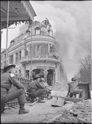 The British Army in North-west Europe 1944-45 Troops clearing snipers in Arnhem, 14 April 1945.