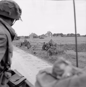 D-day - British Forces during the Invasion of Normandy 6 June 1944 A screen of 6-pdr anti-tank guns in position by the side of the Rue de la Croix Rose in Hermanville-sur-Mer, 6 June 1944. The Route de Caen can be seen going off to the right.