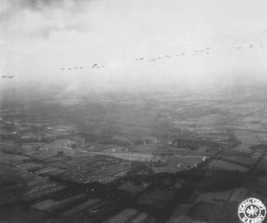 A fleet of Allied aircraft flies overhead as paratroopers of the Allied Airborne Command float groundward in the invasion of the Netherlands, still another step towards the liberation of Europe. September 17, 1944. Tischler, Air Transport Command. (Army) NARA FILE #: 111-SC-210047 WAR &amp; CONFLICT BOOK #: 1065