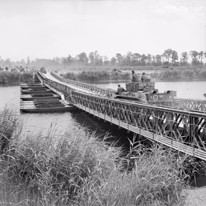The British Army in Normandy 1944 Cromwell tanks moving across 'York' bridge, a Bailey bridge over the Caen canal and the Orne river, during Operation 'Goodwood', 18 July 1944.