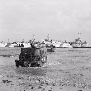 Universal Carriers of the British 50th Division wade ashore from LCTs on Jig sector Gold Beach — IWM B5244 — 6 June 1944