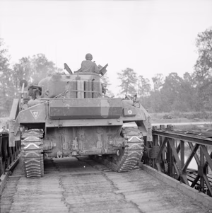 The British Army in Normandy 1944 A Sherman Crab flail tank crosses a Bailey bridge over the Orne, as it moves up to the start line for Operation 'Goodwood', 18 July 1944.