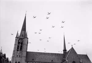 American C-47 aircraft flying over Gheel in Belgium on their way to Holland for Operation 'Market-Garden' , 17 September 1944. American C-47 aircraft flying over Gheel in Belgium on their way to Holland for Operation 'Market-Garden' , 17 September 1944.