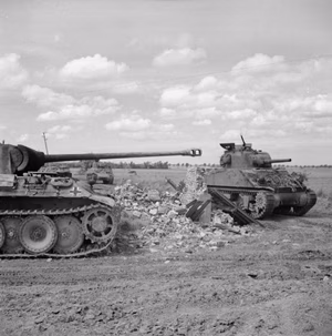The British Army in Normandy 1944 A Sherman tank of 24th Lancers, 8th Armoured Brigade, passing a knocked-out German PzKpfw V Panther tank near Rauray, 30 June 1944.