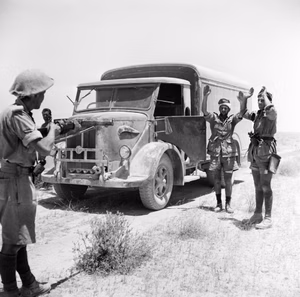 A British infantryman takes the surrender of the crew of an enemy supply truck in the Western Desert, 2 June 1942. An infantryman takes the surrender of the crew of an enemy supply truck in the Western Desert, 2 June 1942.