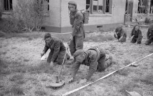 The British Army in Normandy 1944 Sappers clearing the last mines from the beach front of a former French luxury hotel, now in use as a rest club for troops of 3rd Division, 15 July 1944.