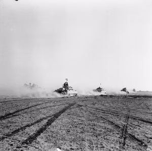 IWM caption : El Alamein 1942: British tanks move up to the battle to engage the German armour after the infantry had cleared gaps in the enemy minefield.