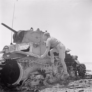 The British Army in North Africa 1942 A soldier inspects an Italian M13/40 tank that was knocked out by anti-tank guns near El Alamein, 11 July 1942.