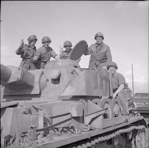 The British Army in Normandy 1944 The crew of a Sherman ARV pose with an intact German PzKpfw IV tank which they successfully recovered and brought back to 27th Armoured Brigade workshops, 3 July 1944. This vehicle had the turret number '612'.