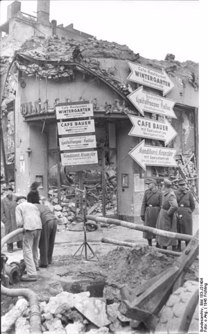 For documentary purposes the German Federal Archive often retained the original image captions , which may be erroneous, biased, obsolete or politically extreme . Berlin, zerstörter "Wintergarten" ADN-ZB/Archiv II. Weltkrieg 1939-45 Zerstörungen in Berlin durch anglo-amerikanische Bombenangriffe 1945 An der Eck Friedrich- und Dorotheestraße, hier befand sich das Cafe "Wintergarten", weisen Plakate auf die neuen Standorte der Gaststätten hin. (Aufnahme entstand vor dem 9.4.1945) 343-45