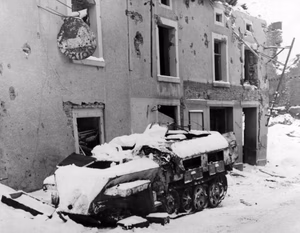 An abandoned German Sonderkraftfahrzeug 251 half-track in Houffalize, Belgium, in February 1945.