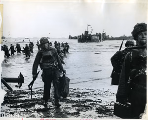American assault troops with full equipment move onto Omaha Beach — Signal Corps SC-189902 — 6 June 1944