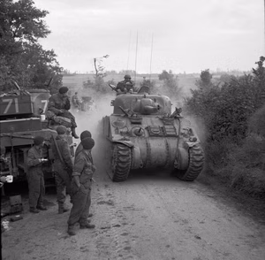 The Battle For Normandy, 1944 Sherman tanks of 33rd Armoured Brigade, supporting 3rd Infantry Division, moving forward near Lebisey Wood for Operation CHARNWOOD, the assault on Caen, 8 July 1944.