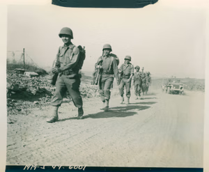 'MM-5-44-6001'; 'Signal Corps photo 29 May 1944 (Italy) Destination Rome. Japanese-American infantrymen, of a Fifth Army division which played a notable role in the spectacular offensive, are shown moving up to the front near Velletri to tackle another town on the road to Rome. Sig. C.[Signal Corps] radio telephoto from Italy.' Velletri, Italy. 29 May 1944