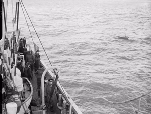 How the Royal Navy Cleared the Scheldt To Antwerp. November 1944, on Board a Byms and at Terneuzen and Antwerp. Minesweeping Operations in the River Scheldt To Allow Access Into Antwerp. Sailors hoisting up the float after a sweep had parted on an under-water obstruction.