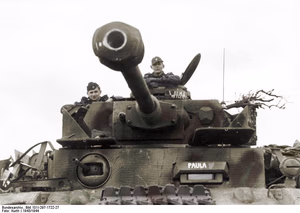 This is a retouched picture , which means that it has been digitally altered from its original version. Modifications: recolored . The original can be viewed here: Bundesarchiv Bild 101I-297-1722-27, Im Westen, Panzer IV.jpg : . Modifications made by Ruffneck'88 . .mw-parser-output table.commons-file-information-table,.mw-parser-output .fileinfotpl-type-information,.mw-parser-output .fileinfotpl-type-artwork{border:1px solid var(--border-color-base,#a2a9b1);background-color:var(--background-color-interactive-subtle,#f8f9fa);padding:5px;font-size:95%;border-spacing:2px;box-sizing:border-box;margin:0;width:100%;color:inherit}.mw-parser-output table.commons-file-information-table>tbody>tr,.mw-parser-output .fileinfotpl-type-information>tbody>tr,.mw-parser-output .fileinfotpl-type-artwork>tbody>tr{vertical-align:top}.mw-parser-output table.commons-file-information-table>tbody>tr>td,.mw-parser-output table.commons-file-information-table>tbody>tr>th,.mw-parser-output .fileinfotpl-type-information>tbody>tr>td,.mw-parser-output .fileinfotpl-type-information>tbody>tr>th,.mw-parser-output .fileinfotpl-type-artwork>tbody>tr>td,.mw-parser-output .fileinfotpl-type-artwork>tbody>tr>th{padding:4px}.mw-parser-output .fileinfo-paramfield{background:#ccf;text-align:right;padding-right:0.4em;width:15%;font-weight:bold;color:inherit}.mw-parser-output .commons-file-information-table+table.commons-file-information-table,.mw-parser-output .commons-file-information-table+div.commons-file-information-table>table{border-top:0;padding-top:0;margin-top:-8px}@media only screen and (max-width:719px){.mw-parser-output table.commons-file-information-table,.mw-parser-output .commons-file-information-table .fileinfotpl-type-information,.mw-parser-output .commons-file-information-table .fileinfotpl-type-artwork{border-spacing:0;padding:0;word-break:break-word;width:100%!important}.mw-parser-output .commons-file-information-table>tbody,.mw-parser-output .fileinfotpl-type-information>tbody,.mw-parser-output .fileinfotpl-type-artwork>tbody{display:block}.mw-parser-output .commons-file-information-table>tbody>tr>td,.mw-parser-output .commons-file-information-table>tbody>tr>th,.mw-parser-output .fileinfotpl-type-information>tbody>tr>td,.mw-parser-output .fileinfotpl-type-information>tbody>tr>th,.mw-parser-output .fileinfotpl-type-artwork>tbody>tr>td,.mw-parser-output .fileinfotpl-type-artwork>tbody>tr>th{padding:0.2em 0.4em;text-align:left;text-align:start}.mw-parser-output .commons-file-information-table>tbody>tr,.mw-parser-output .fileinfotpl-type-information>tbody>tr,.mw-parser-output .fileinfotpl-type-artwork>tbody>tr{display:flex;flex-direction:column}.mw-parser-output .commons-file-information-table+table.commons-file-information-table,.mw-parser-output .commons-file-information-table+div.commons-file-information-table>table{margin-top:-1px}.mw-parser-output table .fileinfo-paramfield{box-sizing:border-box;flex:1 0 100%;width:100%}}.mw-parser-output table.commons-file-information-table,.mw-parser-output .fileinfotpl-type-information,.mw-parser-output .fileinfotpl-type-artwork,.mw-parser-output .fileinfo-paramfield{color:var(--color-base,#202122)}html.skin-theme-clientpref-night .mw-parser-output .fileinfo-paramfield{background:#2a2a5c;color:white}html.skin-theme-clientpref-night .mw-parser-output .fileinfotpl-type-artwork tbody>tr>th[style*="#ccf"]{background-color:#2a2a5c!important;color:white}@media screen and (prefers-color-scheme:dark){html.skin-theme-clientpref-os .mw-parser-output .fileinfo-paramfield{background:#2a2a5c;color:white}html.skin-theme-clientpref-os .mw-parser-output .fileinfotpl-type-artwork tbody>tr>th[style*="#ccf"]{background-color:#2a2a5c!important;color:white}} Im Westen, Panzer IV ( ) Photographer Kurth Archive description InfoField Description provided by the archive when the original description is incomplete or wrong. You can help by reporting errors and typos at Commons:Bundesarchiv/Error reports . Belgien, Frankreich.- II. SS-Panzer-Regiment 12 "Hitlerjugend". Panzer IV mit Seitenschürzen (Bezeichnung über Sichtfenster "Paula", Beschriftung am Ausguck Kommandant "Wilma"). Übung unter Aufsicht von Offizieren des Heeres; PK 698 Title Im Westen, Panzer IV Depicted place Im Westen Date 1943 date QS:P571,+1943-00-00T00:00:00Z/9 Collection German Federal Archives Native name Das Bundesarchiv Parent institution Federal Government Commissioner for Culture and Media Location Koblenz (headquarters) Coordinates 50° 20′ 32.71″ N, 7° 34′ 21.22″ E Established 1946 Website www.bundesarchiv.de Authority file : Q685753 VIAF : 137346469 ISNI : 0000000405552728 LCCN : n92025526 NLA : 36455393 OSM : 1844909 WorldCat institution QS:P195,Q685753 Current location Propagandakompanien der Wehrmacht - Heer und Luftwaffe (Bild 101 I) Accession number Bild 101I-297-1722-27 Source This image was provided to Wikimedia Commons by the German Federal Archive (Deutsches Bundesarchiv) as part of a cooperation project . The German Federal Archive guarantees an authentic representation only using the originals (negative and/or positive), resp. the digitalization of the originals as provided by the Digital Image Archive .