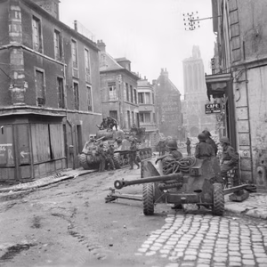 British Sherman tanks and a 6-pdr anti-tank gun in the centre of Caen, Normandy, 10 July 1944. Sherman tanks and 6-pdr anti-tank gun in the centre of Caen, 10 July 1944.
