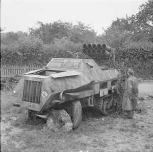 The British Army in Normandy 1944 A British soldier examines an abandoned German Opel Maultier self-propelled Nebelwerfer, in the Falaise-Argentan area, 22 August 1944.