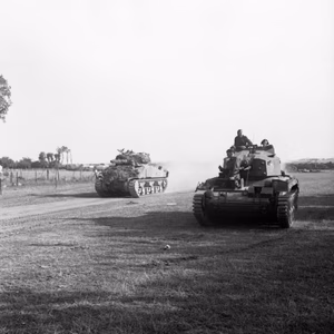 A Sherman tank and Crusader anti-aircraft tank of the Staffordshire Yeomanry, 27th Armoured Brigade, during Operation 'Goodwood', Normandy, 18 July 1944. A Sherman tank and Crusader AA Mk III of the Staffordshire Yeomanry, 27th Armoured Brigade, during Operation 'Goodwood', 18 July 1944.