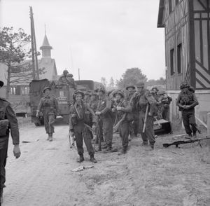 The British Army in Normandy 1944 Men of 2nd Royal Ulster Rifles pause during the move inland from Sword Beach, 6 June 1944.