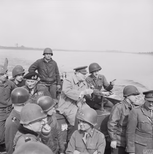 Prime Minister Winston Churchill Crosses the River Rhine, Germany 1945 The Prime Minister Winston Churchill crosses the River Rhine to the east bank, south of Wesel, in an American Landing Craft Vehicle Personnel (or Higgins boat) with Field Marshal Sir Bernard Montgomery, Field Marshal Sir Alan Brooke and US General William Simpson on 25 March 1945.