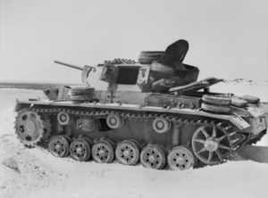 A German Panzer III Ausf.L that was knocked out by Australian anti-tank gunners at El Alamein in August 1942. A small hole slightly above and between the 2nd and 3rd wheels from the right was where the effective shell entered.