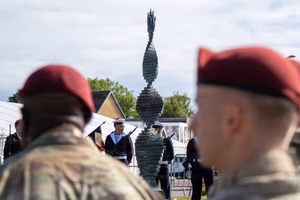 U.S. paratroopers assigned to the 82nd Airborne Division chorus prepare to celebrate the Three Cemeteries Monument during the 82nd commemoration of D-Day at Sainte Mere Eglise, France, June 2, 2026. The Three Cemeteries Monument honors the 14,000 U.S. troops, particularly from the 82nd Airborne Division, who fell during the battle to liberate Normandy, France. On June 6, 1944, the United States military participated in the largest multinational amphibious landing and operational military airdrop in history. This assault led to France’s liberation from the German military and the eventual defeat of the Nazis. By the end of the D-Day invasion, more than 9,000 allied troops were dead or wounded. (U.S. Army photo by Maj. Joe Legros)