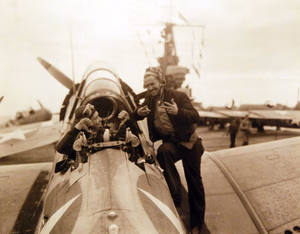 80-G-30247: Operation Torch, November 1942. Planes of USS Ranger (CV-4) en-route to invade French North Africa, November 1942. Aviation Machinist’s Mate 1/C R.M. Price, USNR, offered Aviation Radioman 3/C M.S. Waterson, USN, left $2340 for the latter’s rear seat in a dive bomber but was turned down. Official U.S. Navy Photograph, now in the collections of the National Archives. (2017/06/06).