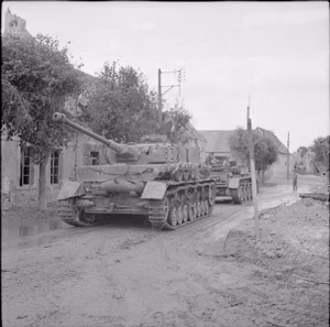 The British Army in Normandy 1944 A Cromwell ARV towing a captured German PzKpfw IV tank, 6 July 1944.