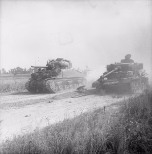 The British Army in the Normandy Campaign 1944 A Sherman tank passes a wrecked German Mk IV near Cagny during Operation 'Goodwood', 18 July 1944.