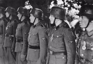 German central picture service World War II 1939-1945 Panzergrenadiers of the SS-Armored Division "Hitlerjugend" lined up to be awarded with the “Iron Cross” July 1944 (Scherl Picture Service).