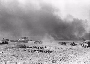 German vehicles on a battlefield (l-r): A captured British Universal Carrier, Sd.Kfz 251/3, a VW Kübelwagen, two motorcycles with sidecars (DKW NZ250/350?) and a Horch Leichter Einheits-PKW. Due to the captured British vehicle and the landscape, the photo was most probably taken in North Africa in 1941.