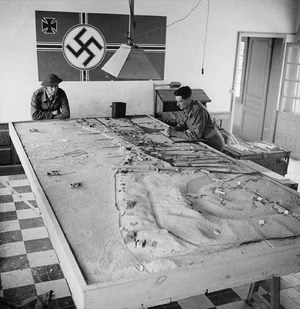 Title / Titre : Two Canadian soldiers survey a model of German defenses, Courseulles-sur-Mer, France, June 6, 1944 / Deux soldats canadiens contemplent une maquette des défenses allemandes, Courseulles sur Mer, France, 6 juin 1944 Creator(s) / Créateur(s) : Lieutenant Ken Bell Date(s) : June 6, 1944 / 6 juin 1944 Reference No. / Numéro de référence : MIKAN 3194303, 3624551 <a href=" http://collectionscanada.gc.ca/ourl/res.php?url_ver=Z39.88-2004&url_tim=2012-04-17T13:51:04Z&url_ctx_fmt=info:ofi/fmt:kev:mtx:ctx&rft_dat=3194303&rfr_id=info:sid/collectionscanada.gc.ca:pam&lang=eng " rel="nofollow">collectionscanada.gc.ca/ourl/res.php?url_ver=Z39.88-2004&...</a> <a href=" http://collectionscanada.gc.ca/ourl/res.php?url_ver=Z39.88-2004&url_tim=2012-04-17T13:51:24Z&url_ctx_fmt=info:ofi/fmt:kev:mtx:ctx&rft_dat=3624551&rfr_id=info:sid/collectionscanada.gc.ca:pam&lang=eng " rel="nofollow">collectionscanada.gc.ca/ourl/res.php?url_ver=Z39.88-2004&...</a> Location / Lieu : Courseulles-sur-Mer, France Credit / Mention de source : Lieutenant Ken Bell. Canada. Department of National Defence. Library and Archives Canada, PA-131438 / Lieutenant Ken Bell. Canada. Ministère de la défense nationale. Bibliothèque et Archives Canada, PA-131438