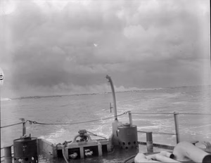 D-day - Allied Forces during the Invasion of Normandy 6 June 1944 The Normandy coast around Bernieres-sur-Mer, Juno assault area, with smoke rising from burning buildings during the Allied naval bombardment which preceded the landings, 6 June 1944.