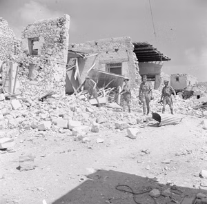 The Campaign in North Africa 1940-1943- Tobruk 1941 - 1942: British troops among the ruins of Tobruk after it had been devastated by air raids.