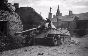 The British Army in the Normandy Campaign 1944 Troops inspect a knocked out King Tiger tank in Le Plessis-Grimoult, 10 August 1944. (Porsche turret).