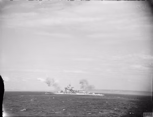 D-day - British Forces during the Invasion of Normandy 6 June 1944 HMS WARSPITE, part of Bombarding Force 'D' off Le Havre, shelling German gun batteries in support of the landings on Sword area, 6 June 1944. The photo was taken from the frigate HMS HOLMES which formed part of the escort group.