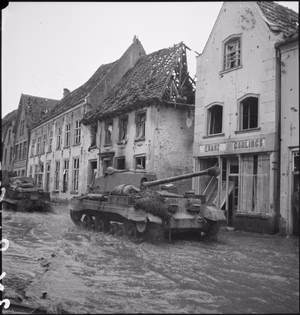The British Army in North-west Europe 1944-45 Archer 17-pdr self-propelled gun in the flooded streets of Kranenburg, 11 February 1945.