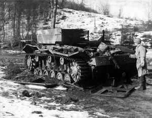A destroyed German Bergepanzer III recovery vehicle near Hosingen, Luxembourg, in February 1945.