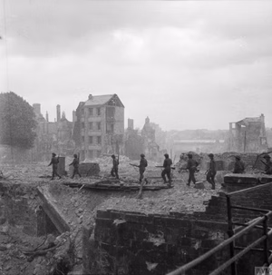 The British Army in Normandy 1944 Royal Engineers move through the ruins of Caen, looking for mines and booby-traps 10 July 1944.