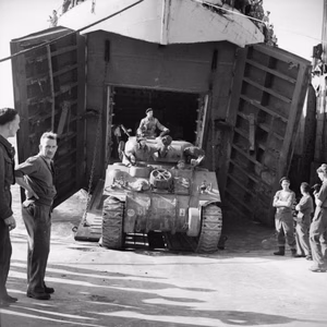 The Polish Army in Normandy 1944 Sherman tank of the 1st Polish Armoured Division disembarking from an LST onto the Mulberry artificial harbour at Arromanches.