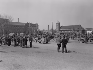 ... the Germans bring entire mass of equipment to a plaza in Sehrlohn, Germany. 16 April, 1945. 7th Armored Division. The Germans are of the 512. Schwere Panzerjäger-Abteilung. Photographer: Pvt. Charles Herr, Jr., 165th Signal Photo Co.